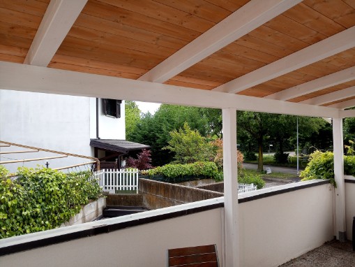 wooden roof covering the balcony